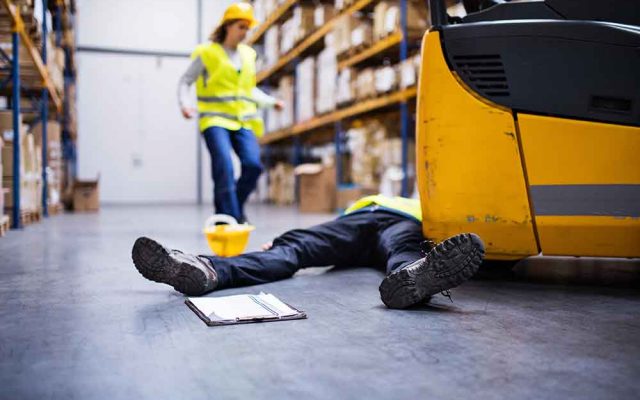 An injured worker after an accident in a warehouse.