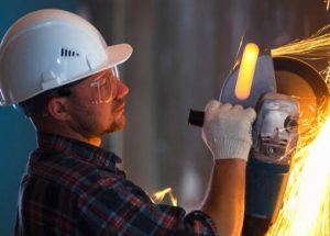 worker using a grinder