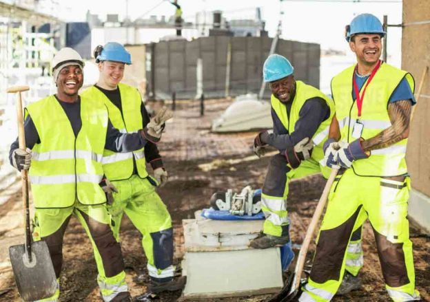 happy construction workers on location