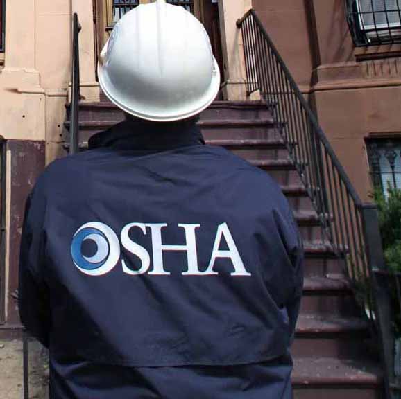 Workplace Hazards with OSHA Insights osha inspector viewing a property under renovation