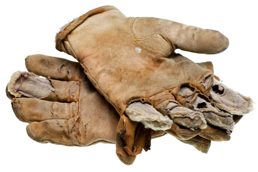 pair of old worn out gloves