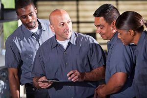 supervisor and crew checking the PPE in an inspection checklist