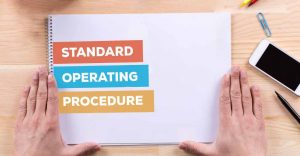 standard operating procedure book on a desk