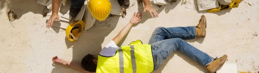 construction worker injured and laying on the ground